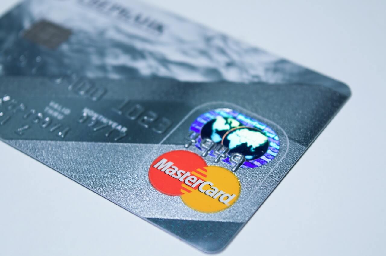 close-up of credit card ready to pay auction fees